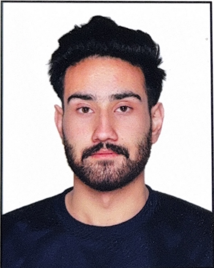 website design A man with dark hair and a beard, wearing a black t-shirt, looking directly at the camera with a neutral