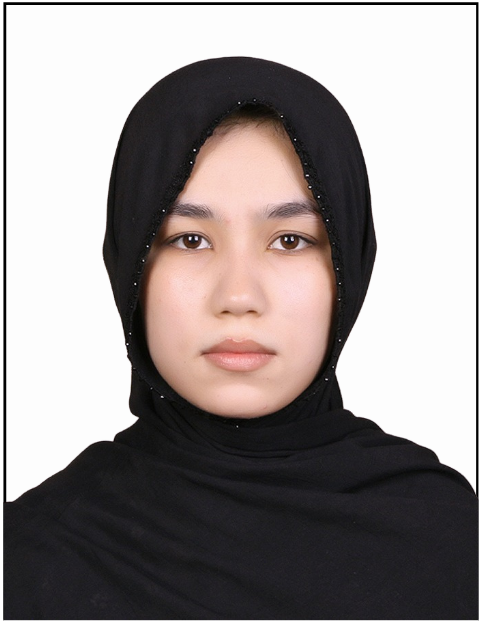 A woman in a black hijab with a serious expression, wearing a black outfit, against a white background, with a focus on